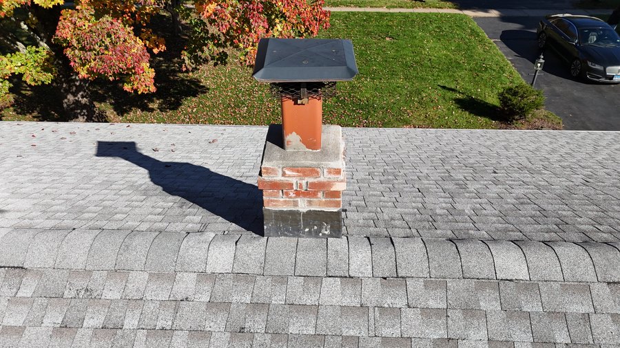 Brick chimney, chimney cap, and surrounding GAF Timberline HDZ shingle roof — Cheshire, CT