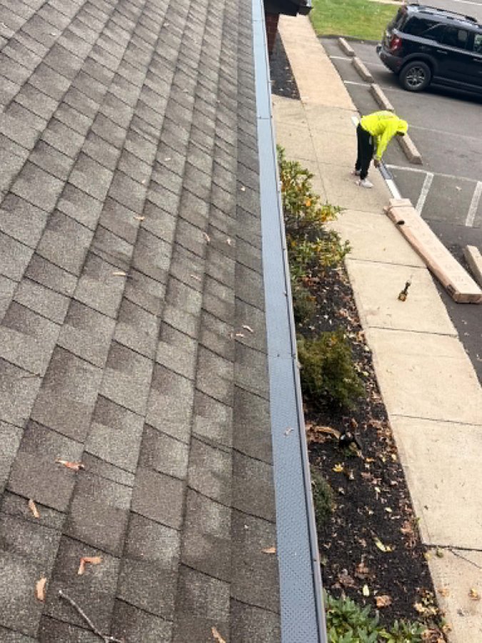 Gutter guards installed along the shingle roof edge - Hamden, CT