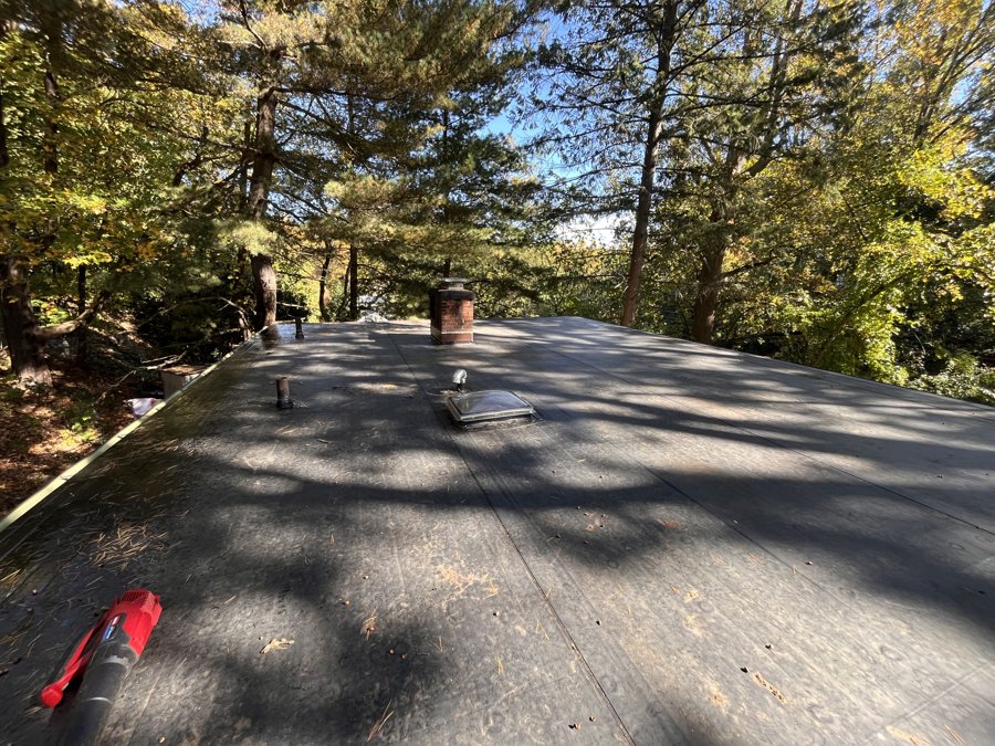 EPDM flat roof with newly installed curb-mounted fixed skylight and roof penetrations - Norwalk, CT (view 2)
