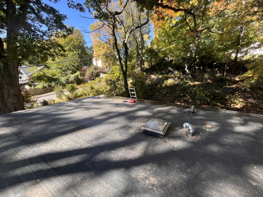EPDM flat roof with newly installed curb-mounted fixed skylight and roof penetrations - Norwalk, CT (view 3)