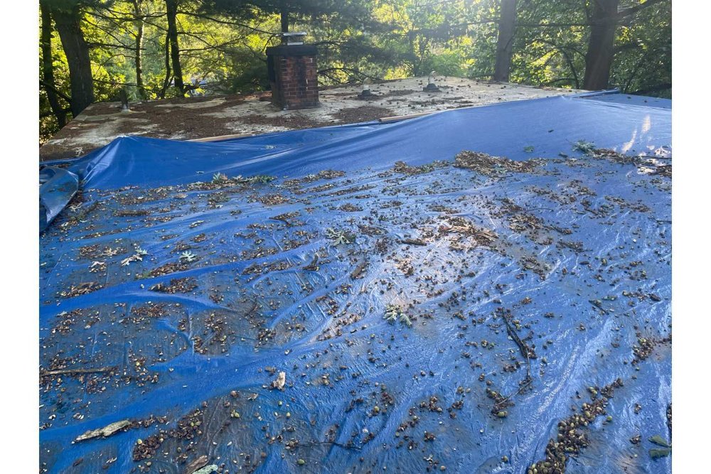 Before: existing roof under a protective tarp - Norwalk, CT